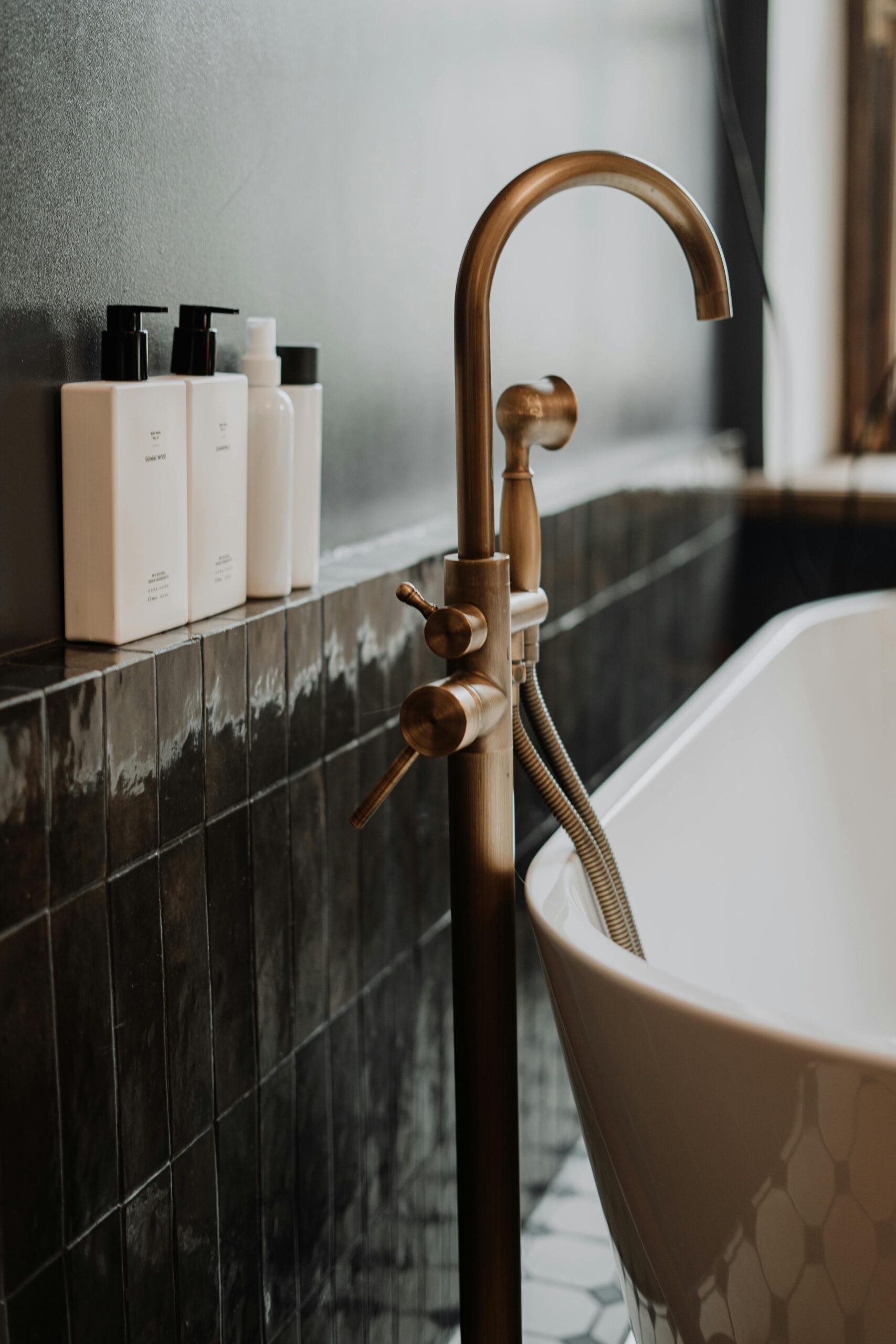 pexels photo 4153152 4153152 2 A modern bathroom with gold fixtures and minimalist soap bottles enhancing its elegant appeal.