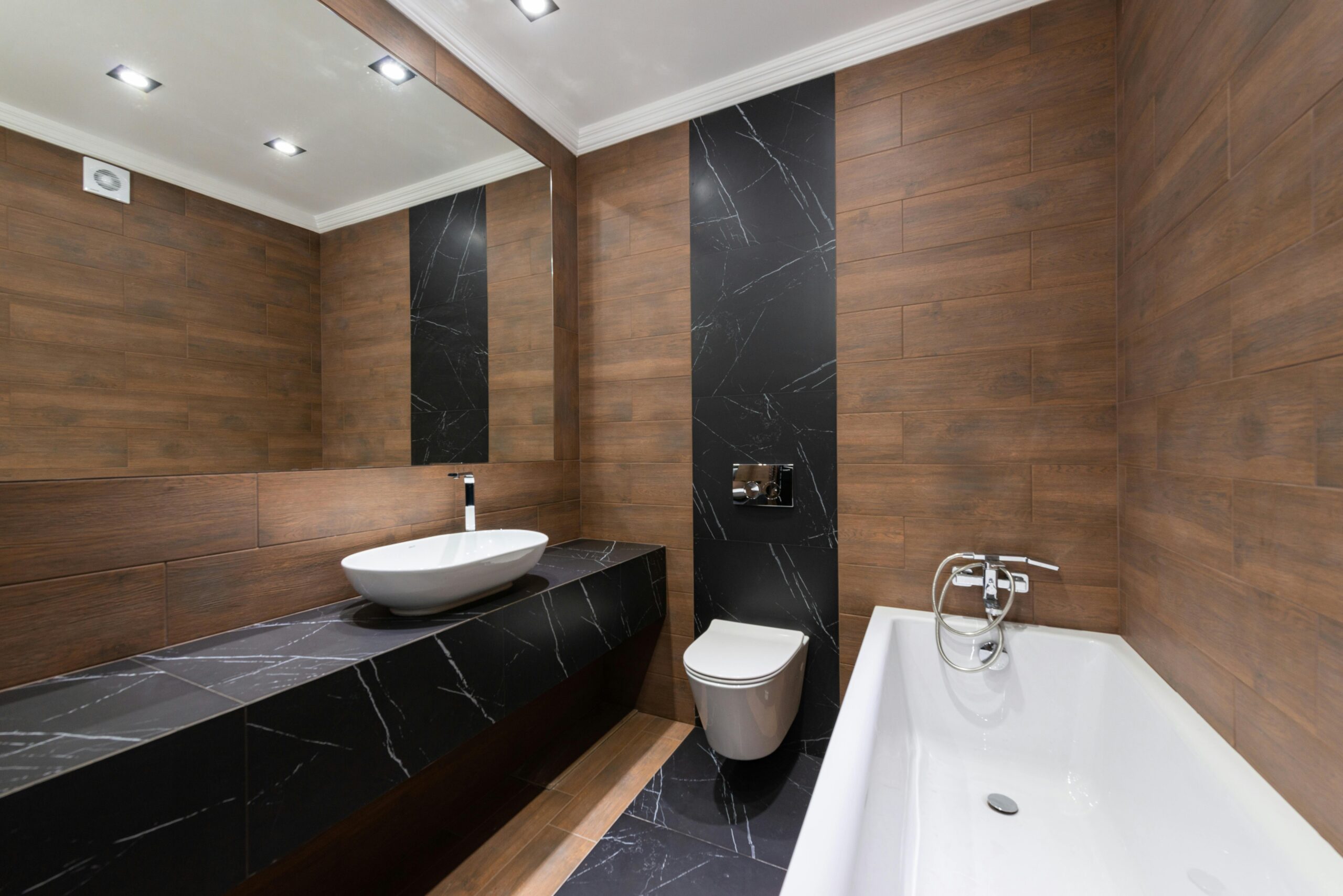 pexels photo 7045358 7045358 1 Modern bathroom with wooden accents, sleek fixtures, and minimalist design.