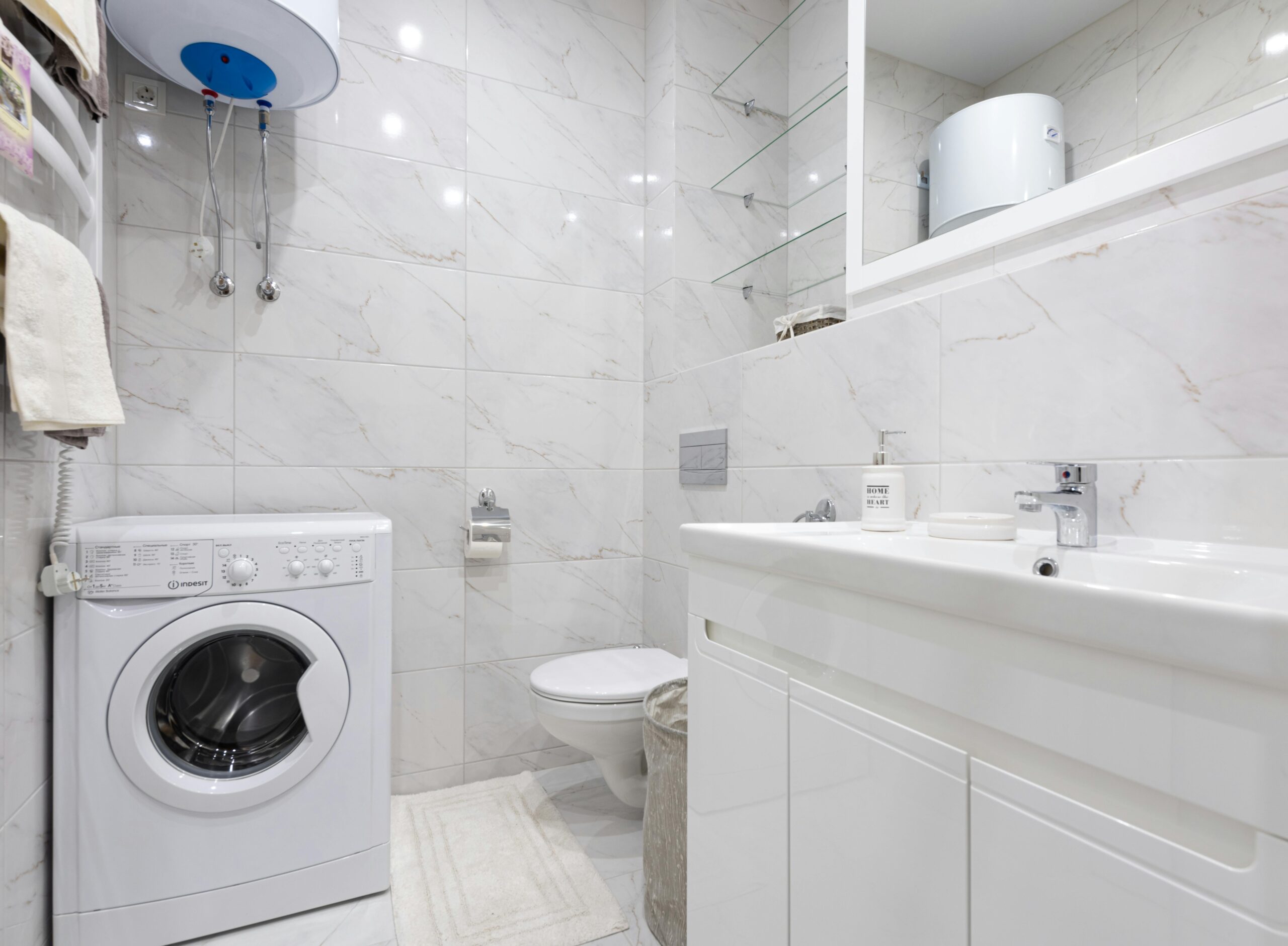pexels photo 8142971 8142971 Bright minimalist bathroom featuring a washing machine and modern fixtures.